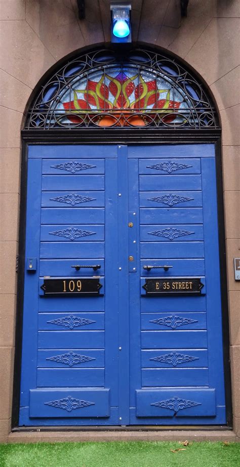 blue arched doorway    street manhattan  york beautiful doors unique doors