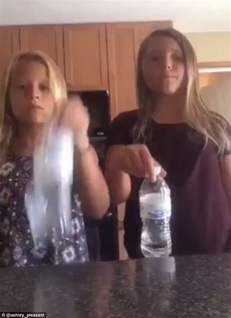 two girls pull off a double bottle flip with one landing on top of the other daily mail online