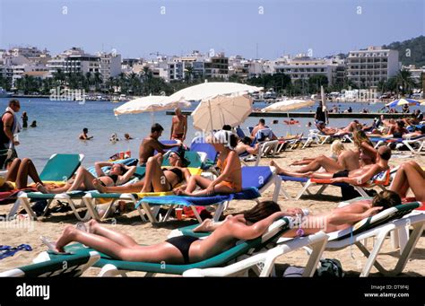 people sunbathing   beach  san antonio ibiza spain stock photo  alamy