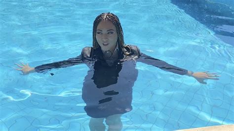 natalia forrest taking a swim in the pool fully clothed in suit and