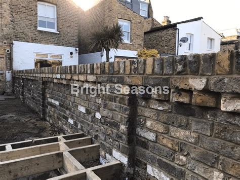 brick wall   built  front   buildings