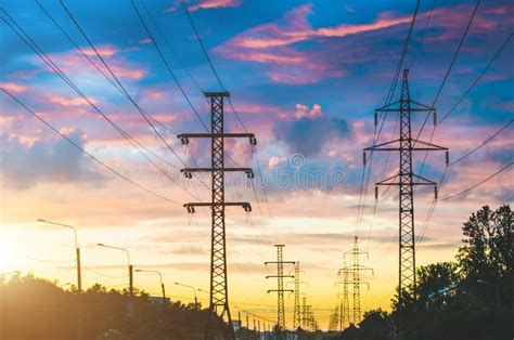 tall power lines  sunset   evening stock image image  energy equipment