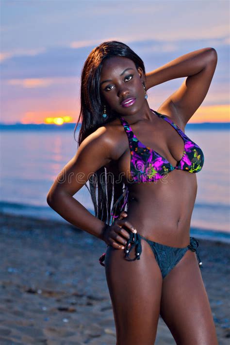 beautiful black african american woman posing on the beach at sunset stock image image of
