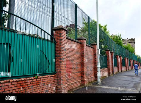 peace wall separating  fountain estate  bishop street derry stock photo royalty