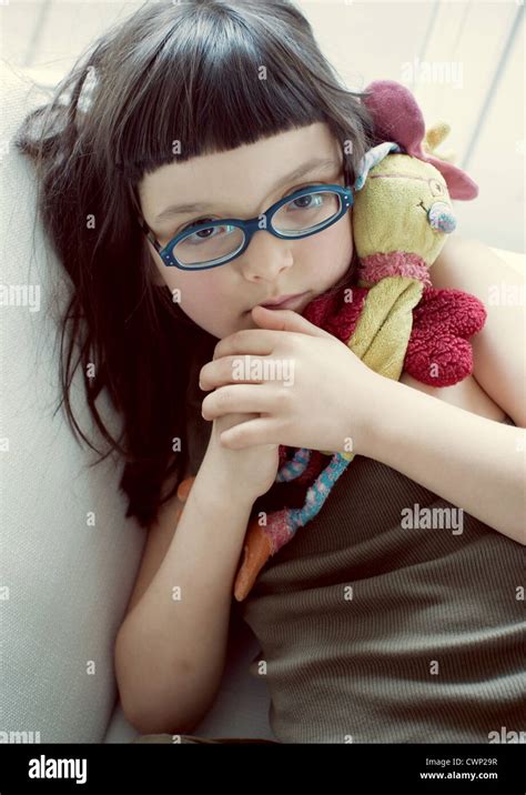 girl holding stuffed toy portrait stock photo alamy