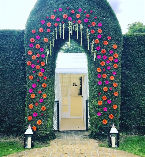 a flower arch full of gerberas jane maples flowers