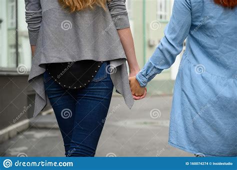 same sex relationships happy lesbian couple walking down