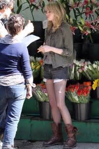 emma stone shows off her skinny legs in ripped stockings on set new movie daily mail online