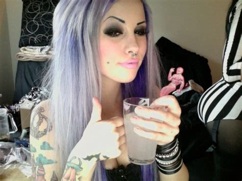 angelica murderotic with purple and silver hair septum piercing cheek piercings and tattoos