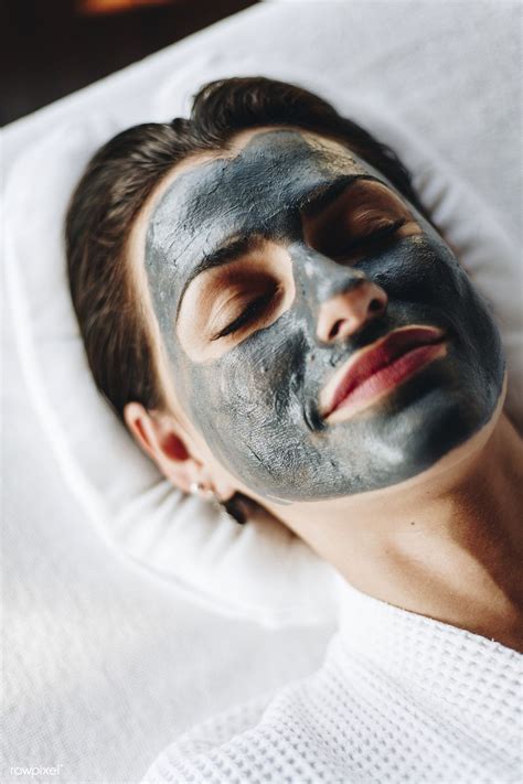 Woman Relaxing With A Facial Mask At The Spa Premium Image By