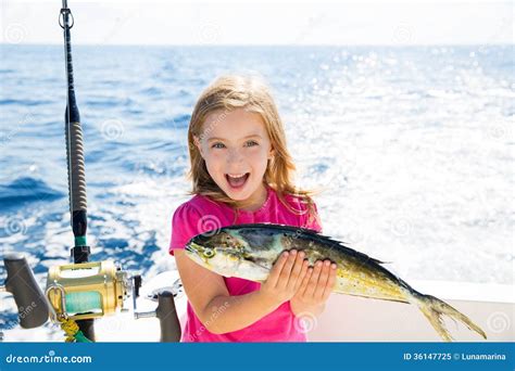 blond kid girl fishing dorado mahi mahi fish happy catch stock image image  fishing excited