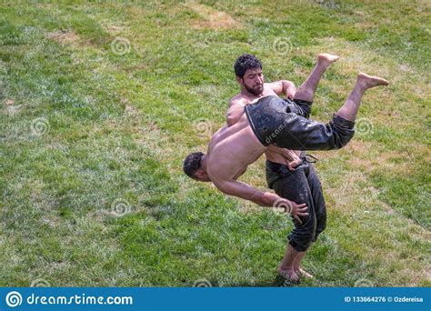 turkish people performing oil wrestling or grease wrestling editorial