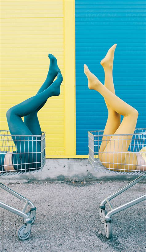 Two Female Friends In Front Of A Blue Yellow Wall By Jovana Rikalo