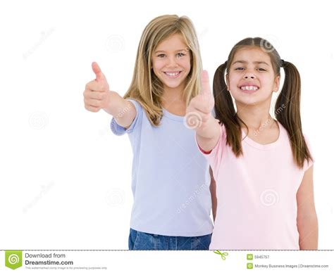 Two Girl Friends Giving Thumbs Up Smiling Stock Image