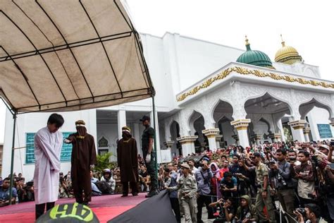 two men in indonesia publicly caned with 82 lashes for having gay sex mirror online