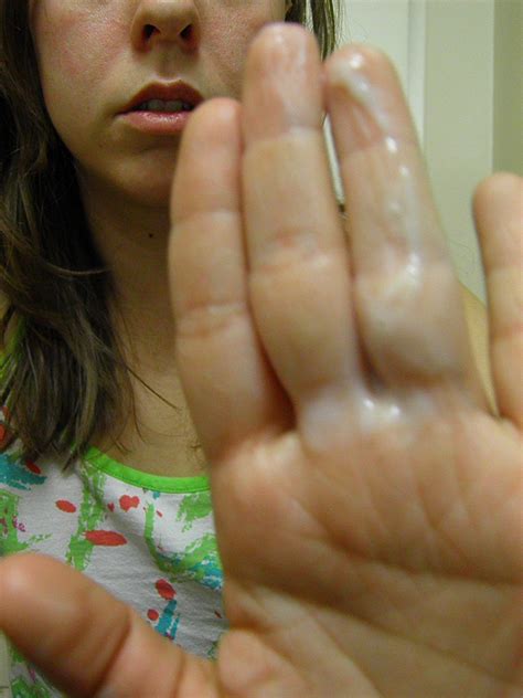 a girl showing and tasting her pussy goo