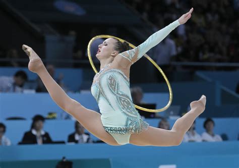 rhythmic gymnasts seem to defy physics cbs news