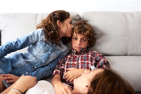 Sister Kissing Her Brother On Sofa By Guille Faingold