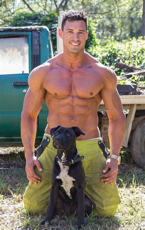 firefighters posing with rescue puppies for charity will