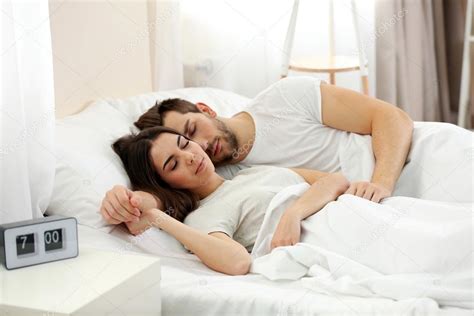 young cute couple sleeping   bed stock photo image   belchonock