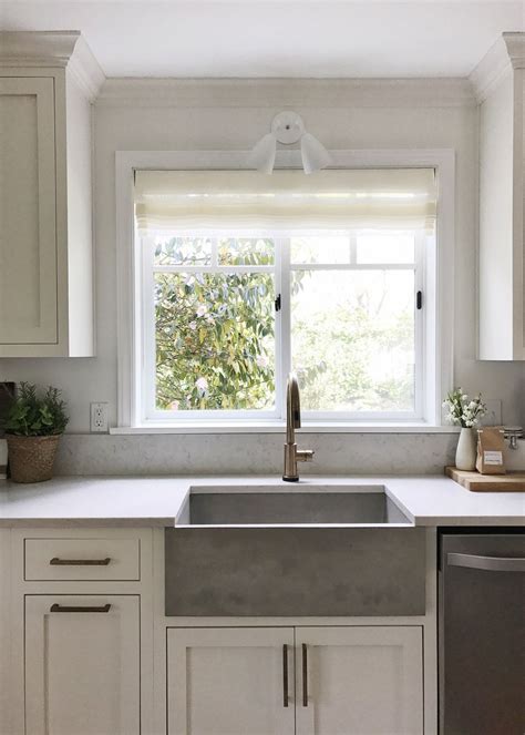 kitchen  white cabinets  stainless steel sink  front   large open window