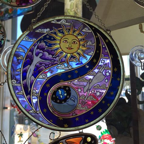 sun  moon  depicted   stained glass art piece hanging