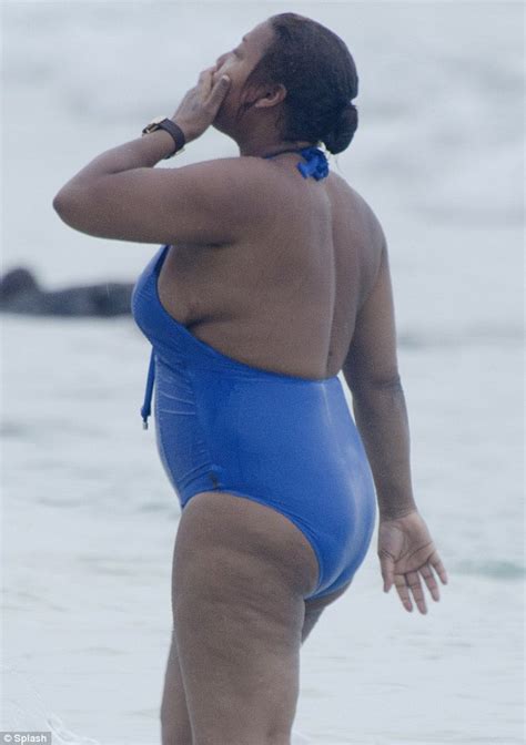 queen latifah busts out of an unflattering swimsuit during