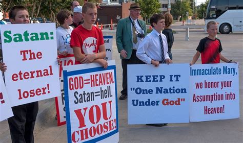 thousands of christians oppose plan to open school satan