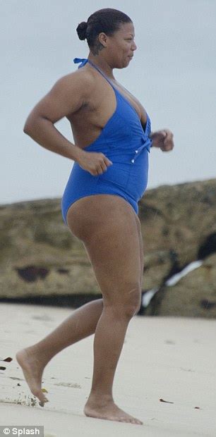 entertainment curvy queen latifah busts out of an