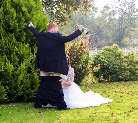 couple simulated sex acts for wedding photos as they