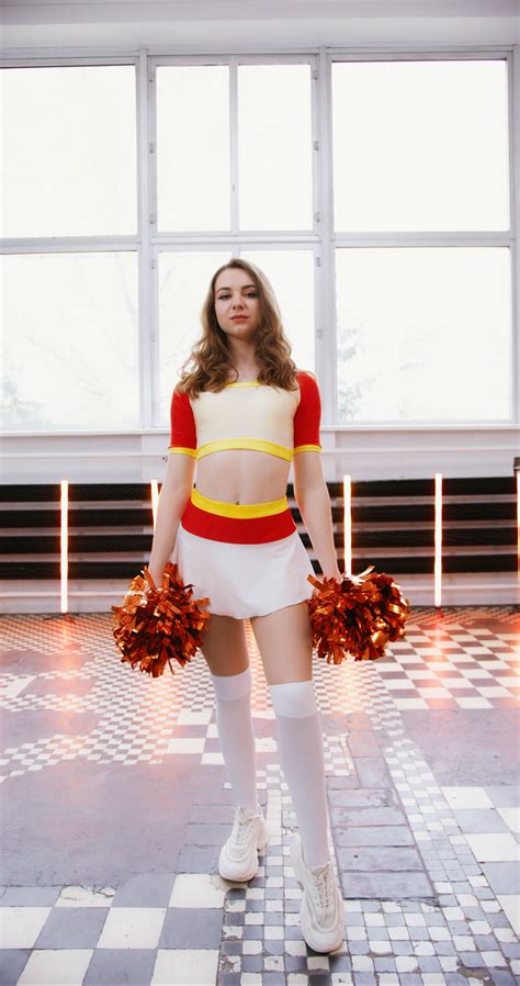 A Cheerleader Holding Pompoms · Free Stock Video
