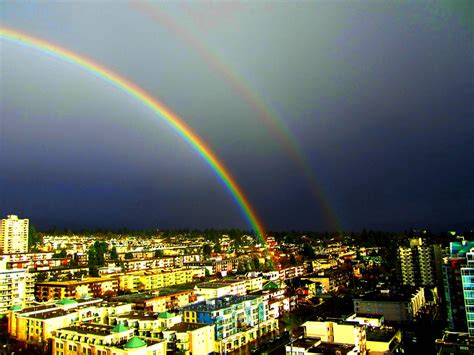 brilliant double rainbow after a sudden rainstorm explore
