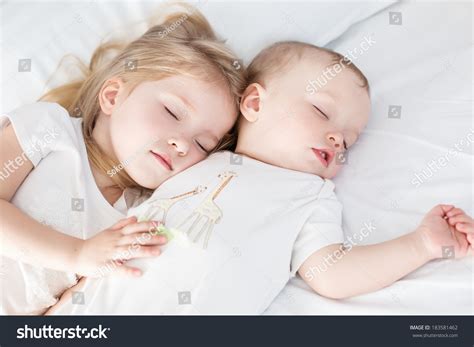 Charming Little Brother And Sister Asleep Embracing On