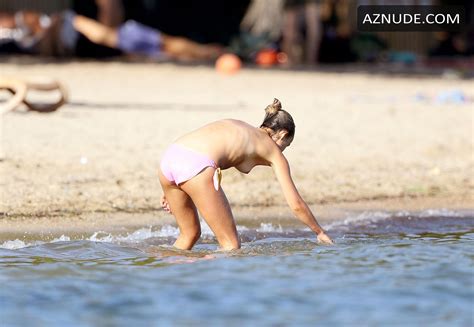 amelia windsor topless while reading a book and sunbathing during her downtime aznude