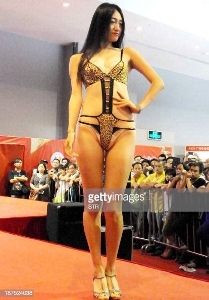 a chinese model shows off a lingerie fashion at the guangzhou sex news photo getty images