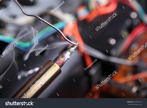 melting solder wire  soldering iron tip stock photo