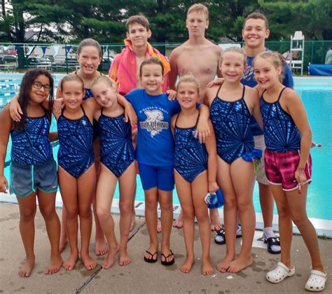 youth swimming dolphins   girls shine  spring green