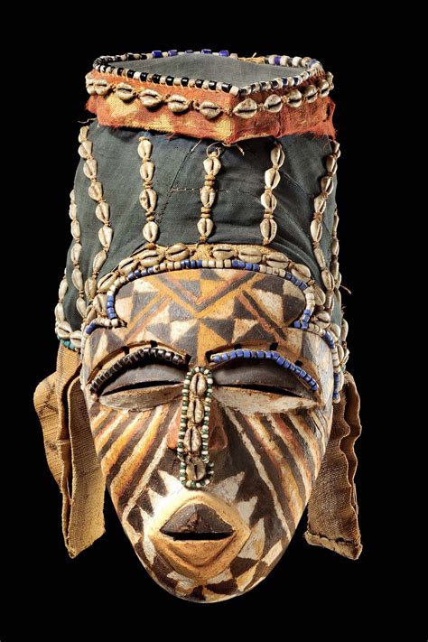 africa mask   kuba people  congo wood polychrome paint cowrie shells fabric