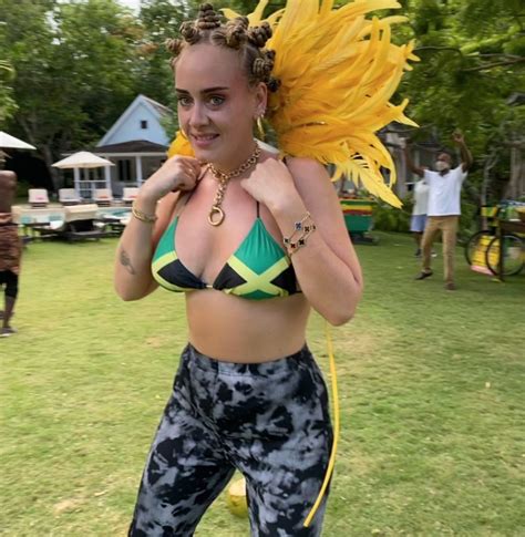 adele faces backlash for wearing jamaican flag bikini bantu knots in