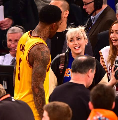 miley cyrus confirmed to be judge on the voice and courtside at knicks game wearing engagement