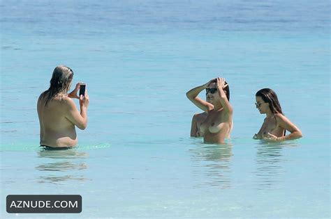 emily ratajkowski topless enjoying the ocean with her friends on