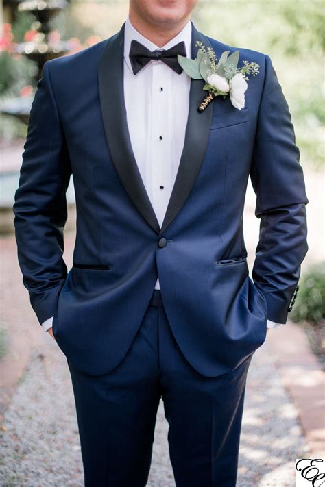 navy blue tux  coral boutonniere designed  engaging