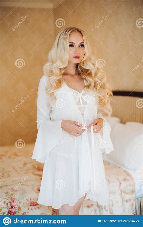 Sexy Blondie Bride In White Lace Lingerie Undressing