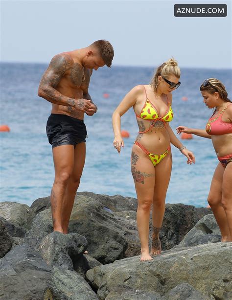 olivia buckland displays her tattooed body in barbados with alex bowen