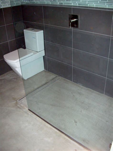 mode concrete modern open concept bathroom featuring  concrete floor  curbless shower