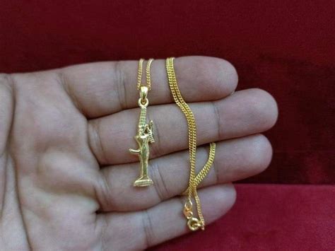 sexuality and fertility ancient egyptian god min necklace 18k gold