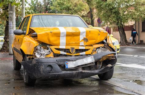 orange car smashed  sidewalk stock photo image  ruined vehicle