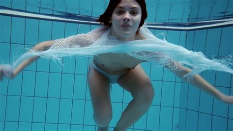 brunette lean fresh russian teen underwater shows her hairy pussy