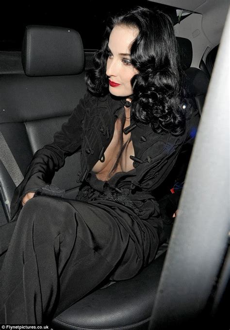 Dita Von Teese Shows Off Her Decolletage As She Steps Out In Sheer Top