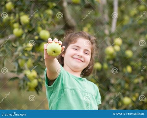 girl showing apple stock image image  child active